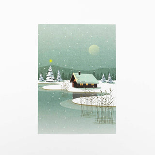 Winterlandschaft mit Haus am See und Schilf