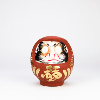 Der Daruma ist ein japanisches Glueckssymbol aus Pappmaché zum Aufstellen.