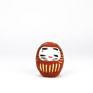 Ein Daruma ist eine bunt bemalte Puppe aus Pappmaché, sie hilft in Japan beim Erfüllen von Wünschen.