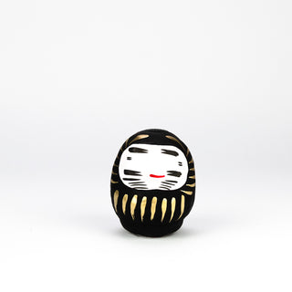 Der Daruma ist eine handbemalte Pappmaché-Puppe aus Japan und soll Glueck bringen.