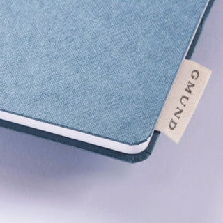 Ein Textillabel mit dem Gmund Logo ist ein feines Detail.