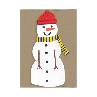 Ein fröhlich lachender Schneemann ist aus Karton gestanzt.
