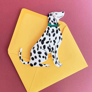 Der aus Karton gestanzte Dalmatiner hat ein echtes Glöckchen am Hals baumeln.